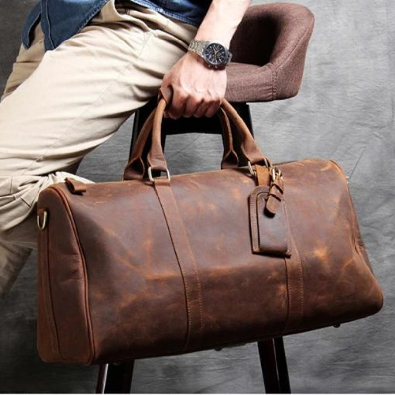 herrentasche aus leder in der hand getragen - Braun - Schwarz