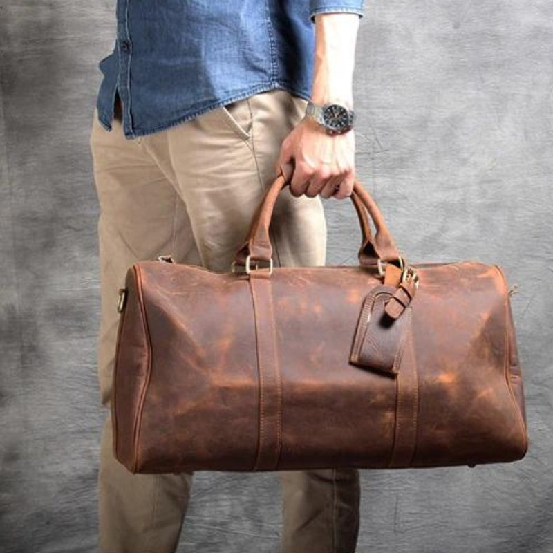 herrentasche aus leder in der hand getragen - Braun - Schwarz